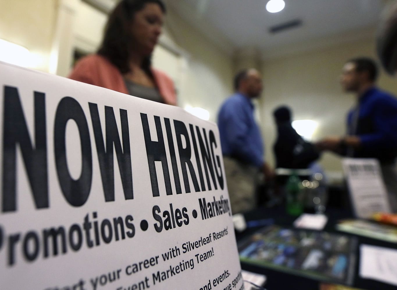 A sign attracts job-seekers during a job fair at the Marriott Hotel in Colonie, N.Y., in 2012.