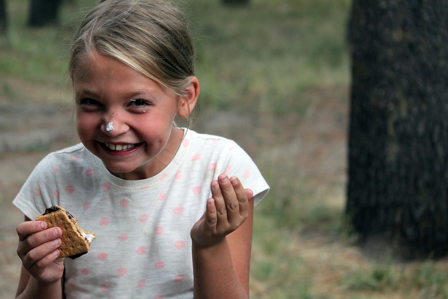 The Treasure Valley Family YMCA
A camper enjoys a s'more during summer cookout night at Adventure Camp in Cascade, Idaho. YMCA summer camps have been around for more than a century, and number more than 300 overnight camps and many day camps.