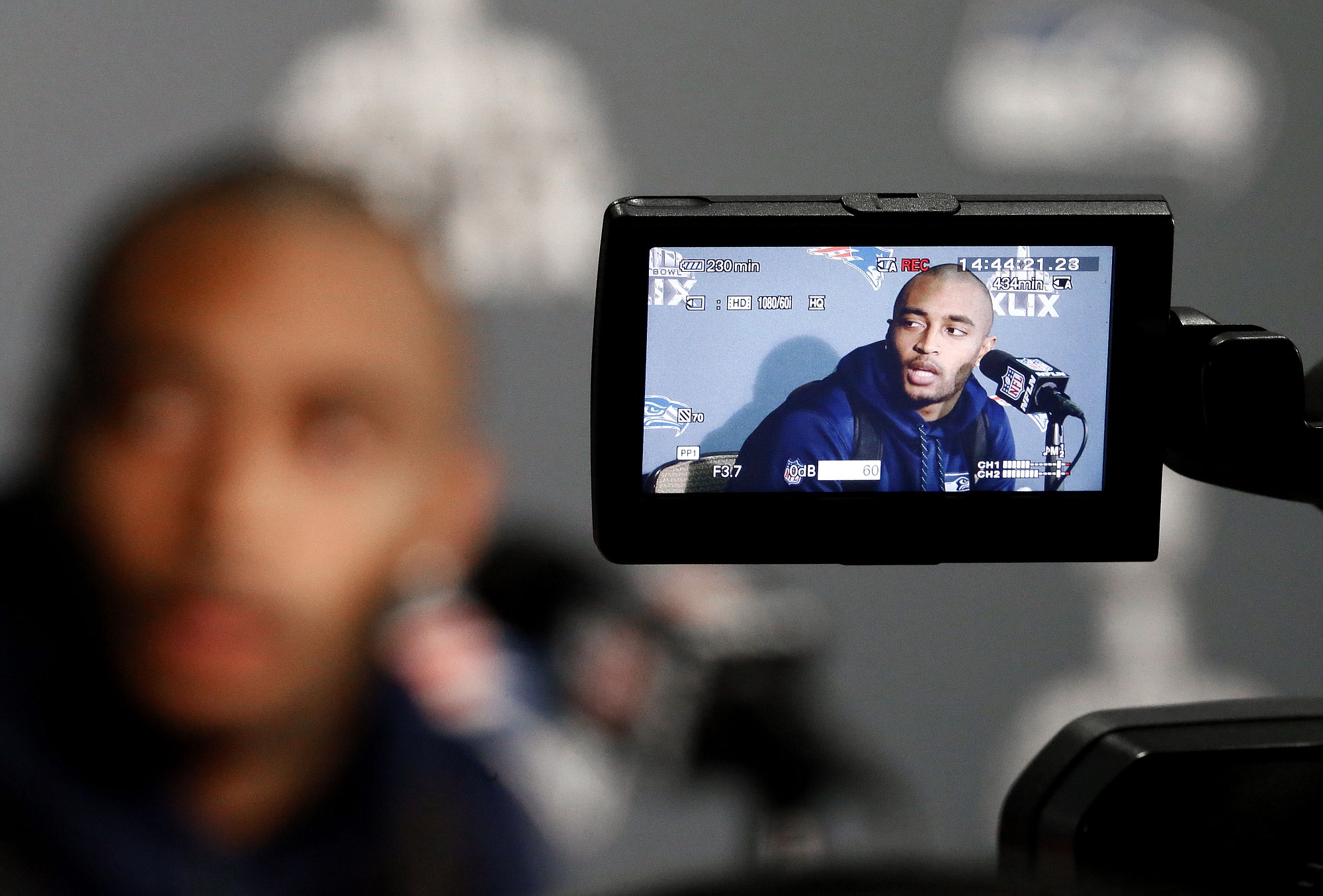 Seattle Seahawks' Doug Baldwin answers a question at a news conference for Super Bowl XLIX on Monday, Jan. 26, 2015, in Phoenix.