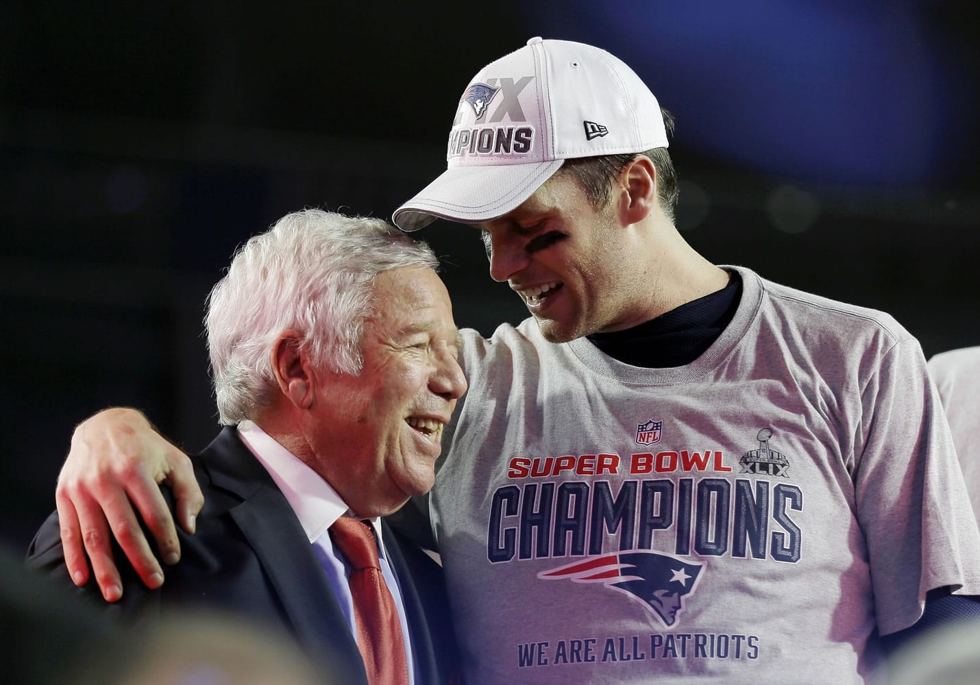 New England Patriots quarterback Tom Brady, right, celebrates with owner Robert Kraft after the NFL Super Bowl XLIX football game against the Seattle Seahawks on Sunday in Glendale, Ariz.