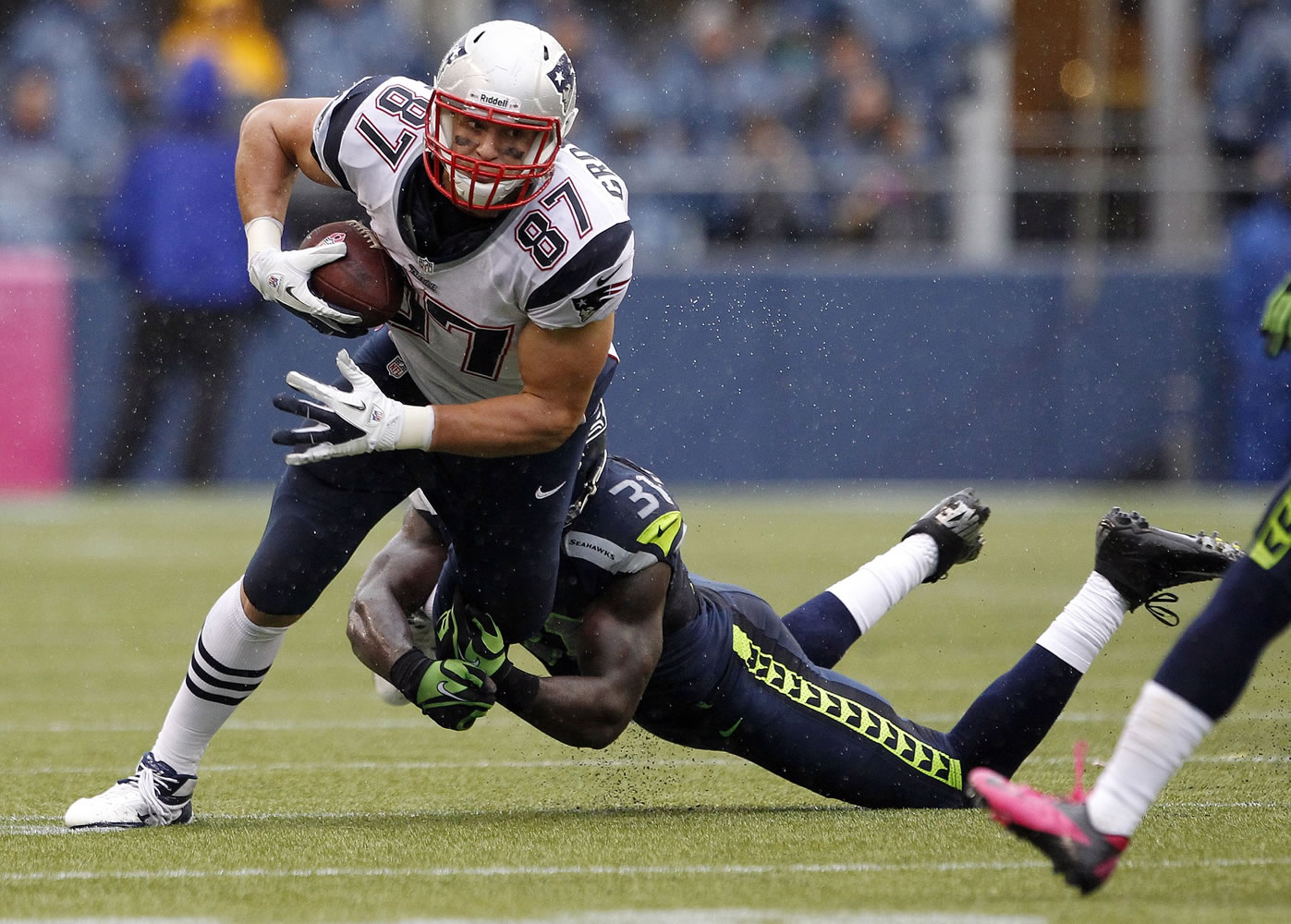 New England Patriots' Rob Gronkowski (87) is tackled by Seattle Seahawks' Kam Chancellor during a game played on Oct. 14, 2012.
