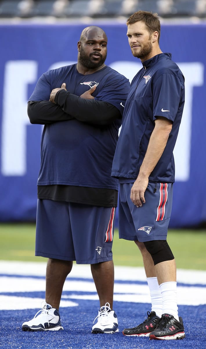 New England Patriots quarterback Tom Brady, right, and defensive tackle Vince Wilfork.