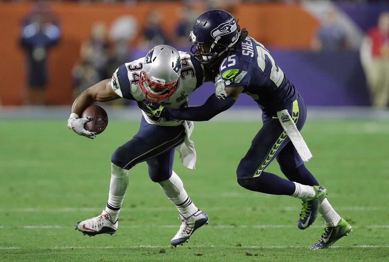 Seattle Seahawks cornerback Richard Sherman (25) tackles New England Patriots running back Shane Vereen (34) during the second half of Super Bowl XLIX on Sunday, Feb. 1, 2015, in Glendale, Ariz.
