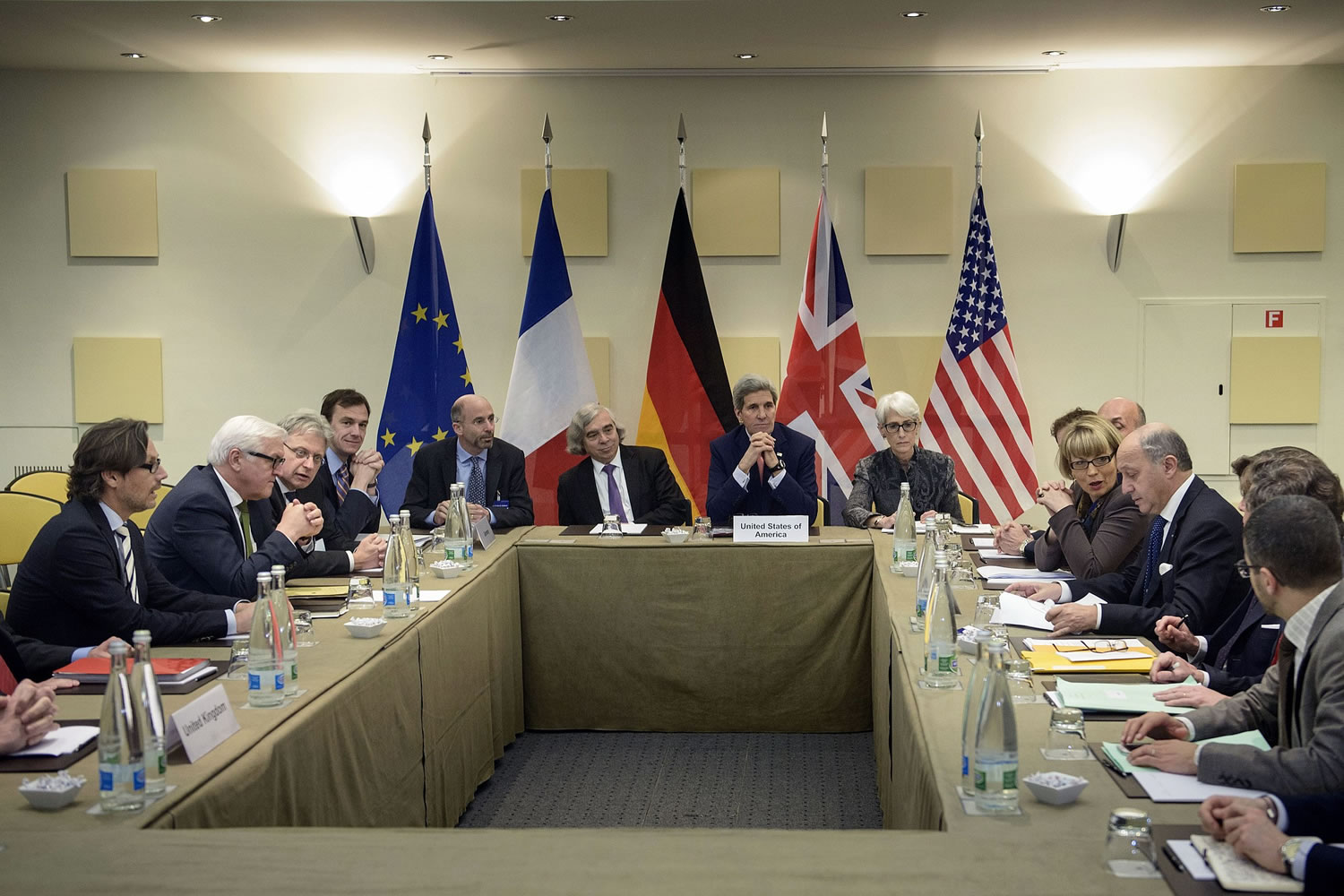 German Foreign Minister, Frank-Walter Steinmeier, 2nd left, US Secretary of Energy, Ernest Moniz, center left, US Secretary of State, John Kerry, center, US Under Secretary for Political Affairs, Wendy Sherman, center right, French Foreign Minister, Laurent Fabius, right, and others wait for the start of a trilateral meeting at an hotel in Lausanne on Saturday. Negotiations over Iran's nuclear program picked up pace on Saturday with the French and German foreign ministers joining U.S.