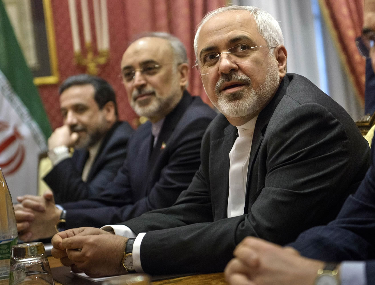 Iranian Foreign Mohammad Minister Javad Zarif , right, waits for the start of a meeting with a US delegation at a hotel in Lausanne Switzerland  on Thursday March 26, 2015 during negotiations on the Iranian nuclear programme.