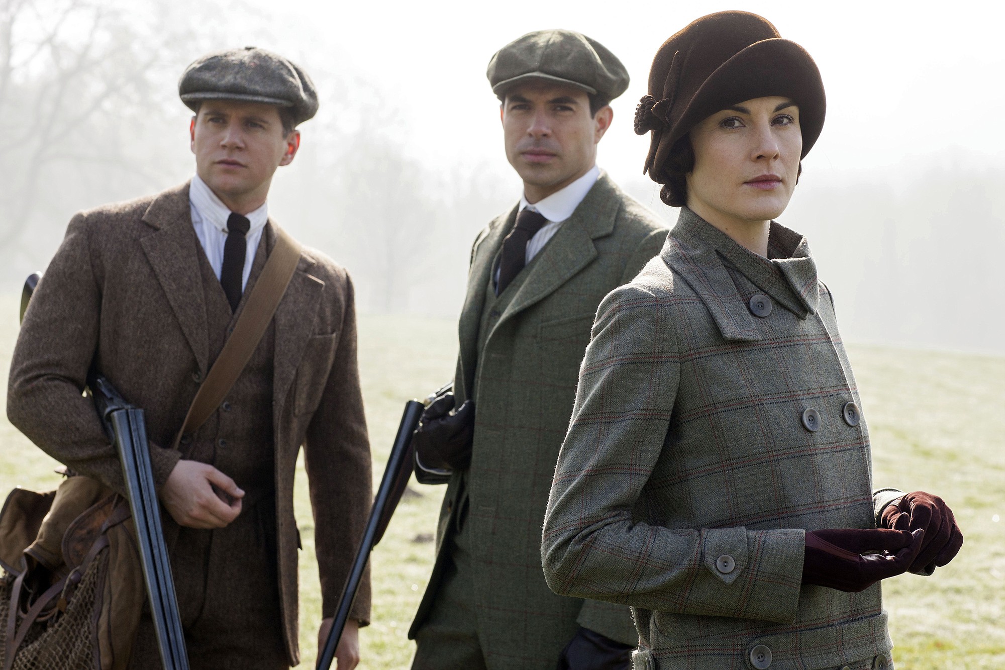 This photo provided by PBS/Masterpiece shows, from left, Allen Leech as Tom Branson, Tom Cullen as Lord Gillingham, and Michelle Dockery as Lady Mary, in a scene from season 5 of &quot;Downton Abbey.&quot; The show premieres Sunday, Jan.