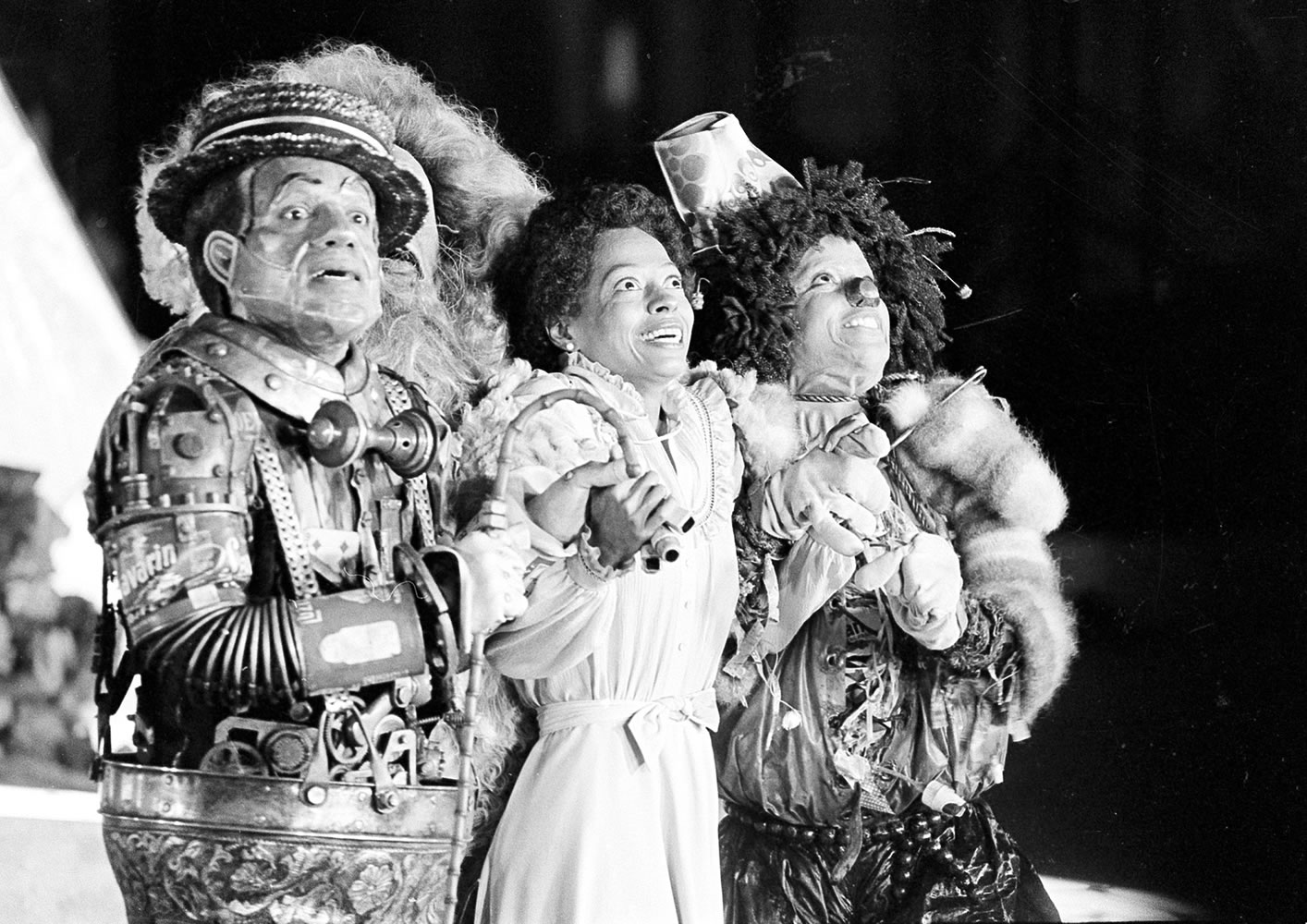 FILE - In this Oct. 4, 1977 file photo, Diana Ross, center, as Dorothy, Michael Jackson, right, as Scarecrow, and Nipsey Russell as Tinman, perform during filming of the musical &quot;The Wiz&quot; in New York's World Trade Center. Ted Ross, portraying the Lion, is partly hidden behind Russell. NBC will air a Dec. 3, 2015 live production of the 1970s stage reinvention of &quot;The Wizard of Oz,&quot; and Cirque du Soleil's new stage theatrical division will present &quot;The Wiz&quot; on Broadway for the 2016-17 season.