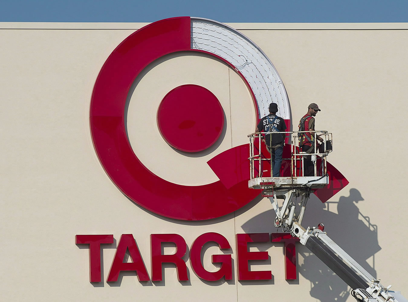 Workers install an outdoor sign at the new Target store at the Mic Mac Mall in Dartmouth, Nova Scotia, in July 2013.