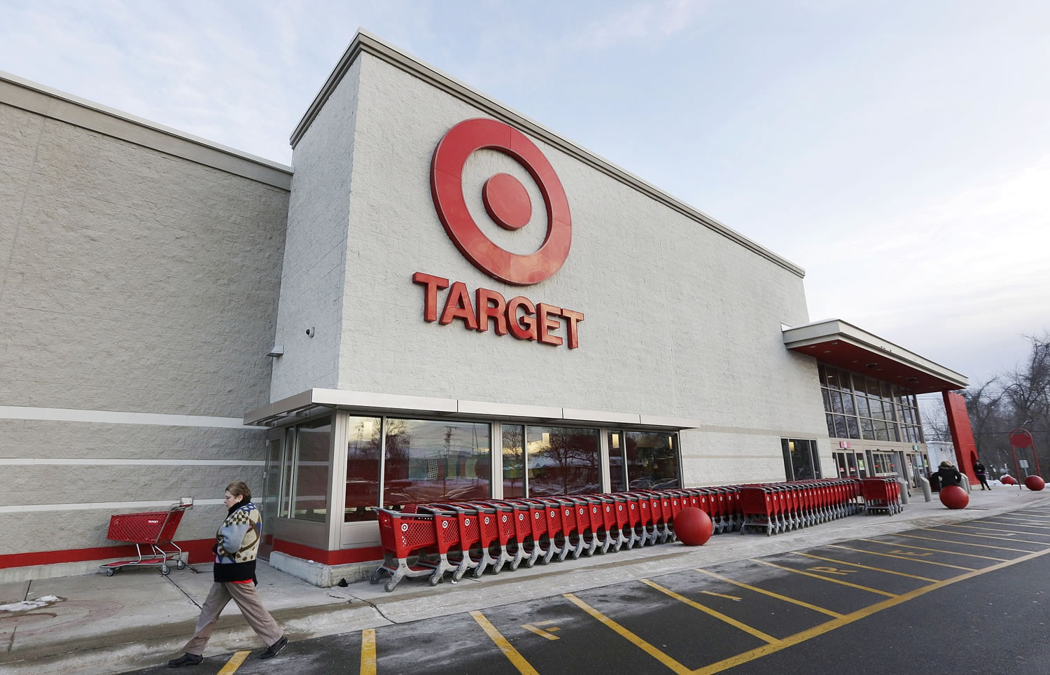 Associated Press files
A passer-by walks near an entrance to a Target retail store in Watertown, Mass.