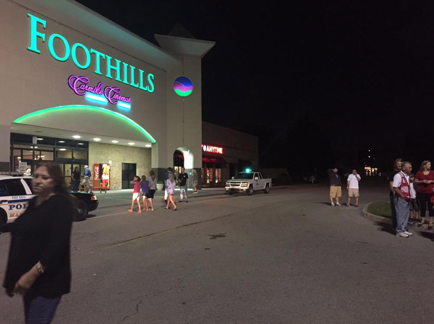 Emergency personnel stand by as evacuees gather at the Foothills Mall early Thursday in Maryville, Tenn.,  after they were forced to leave their homes when rail car carrying a flammable and toxic gas derailed and caught fire.