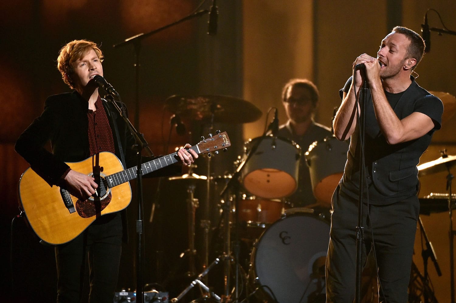 Beck, left, and Chris Martin perform Sunday at the 57th annual Grammy Awards at the Staples Center in Los Angeles.