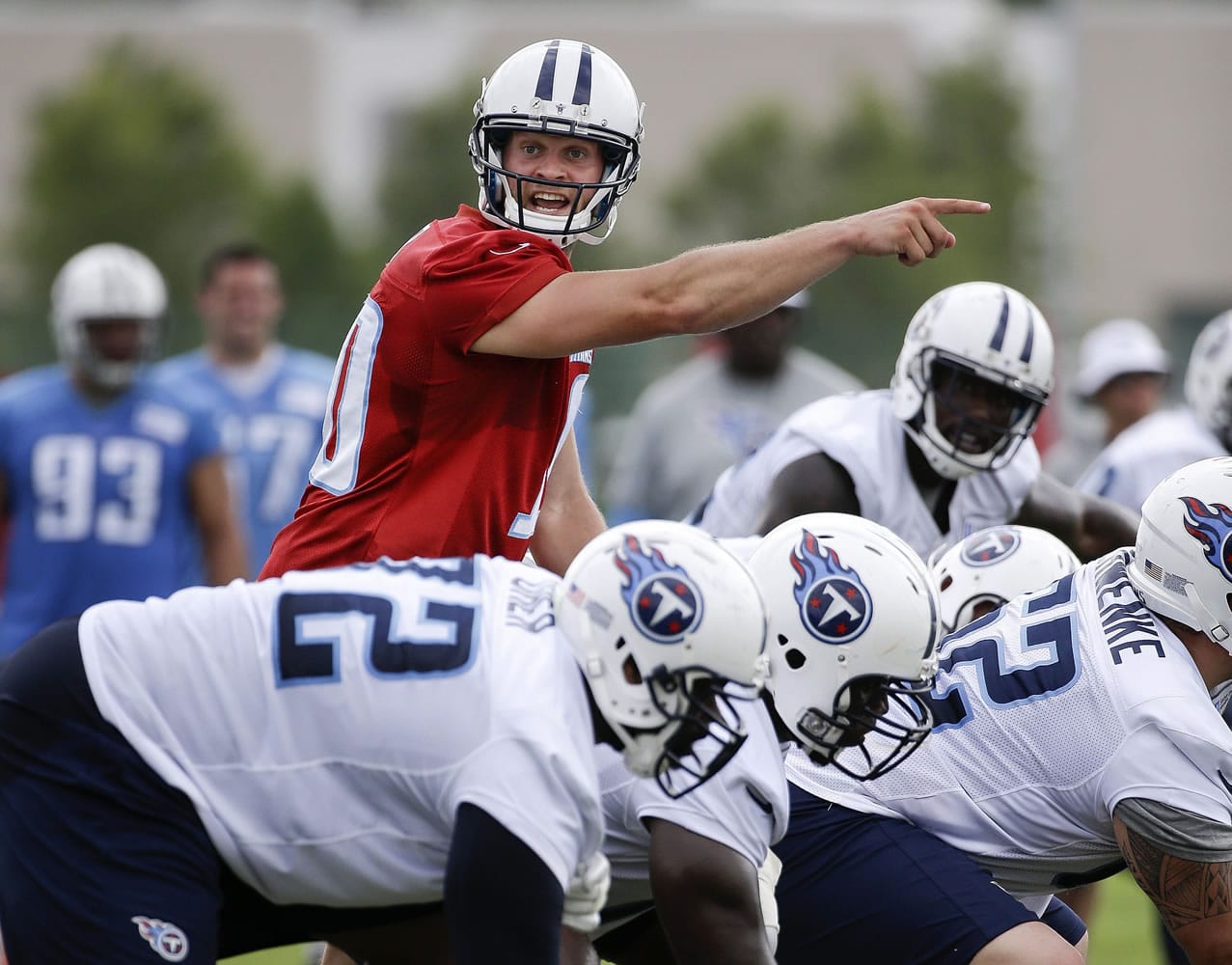 Tennessee Titans quarterback Jake Locker calls a play during NFL football training camp Sunday, July 27, 2014, in Nashville, Tenn.