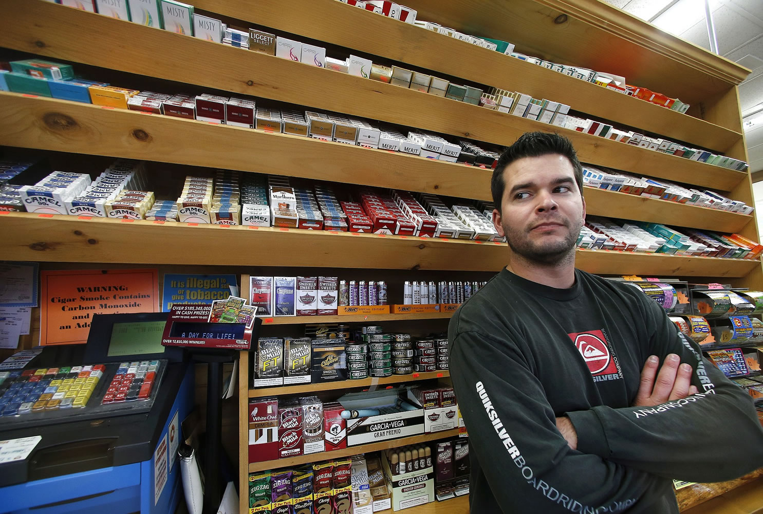 Brian Vincent sells tobacco products at Vincent's Country Store in Westminster, Mass.