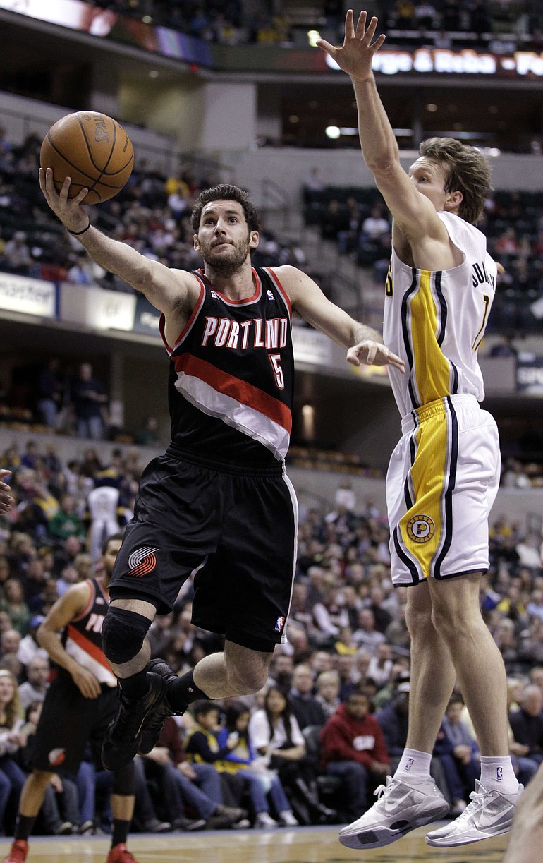 Portland Trail Blazers guard Rudy Fernandez, of Spain, shoots under Indiana Pacers forward Mike Dunleavy in the first half of Friday's game in Indianapolis.