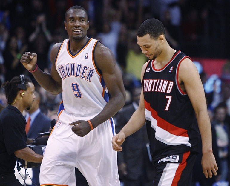 Oklahoma City Thunder forward Serge Ibaka, left, pumps his fist as Portland Trail Blazers guard Brandon Roy, right, walks off the court at the end of Friday's game.