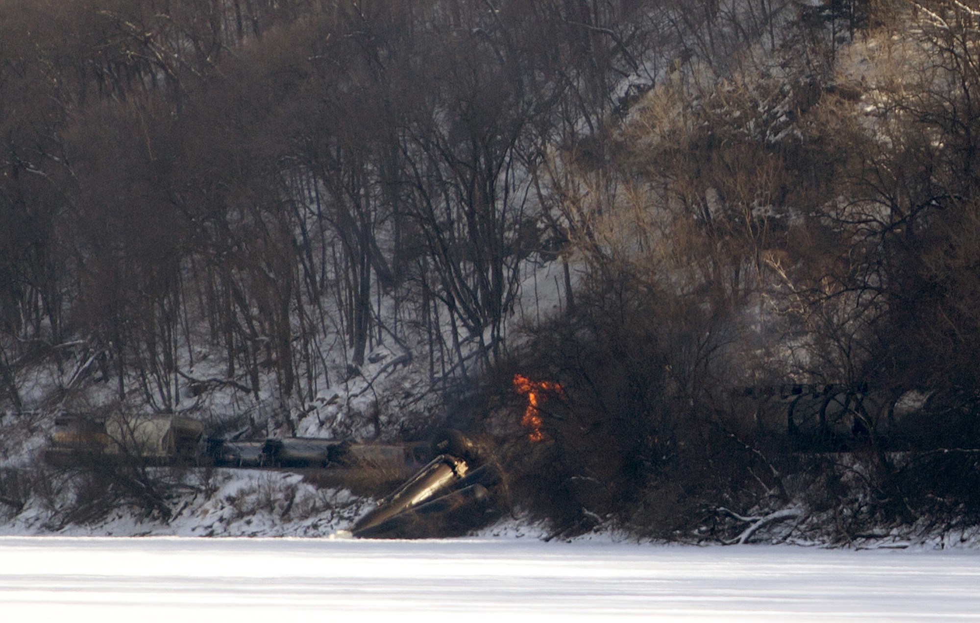Mike Burley/Dubuque Telegraph Herald
Three railcars caught fire and another three plunged into the Mississippi River on Wednesday, north of Dubuque, Iowa. In all, 11 cars derailed; 10 of them were carrying ethanol.