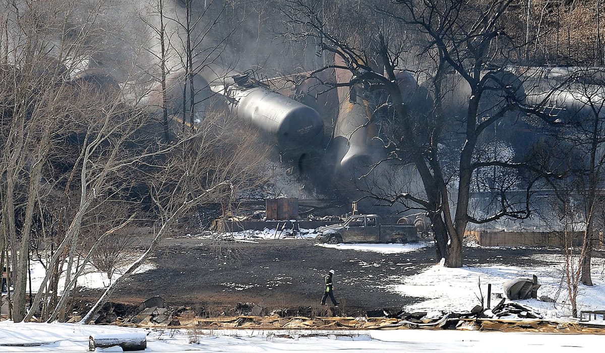 A crew member walks near the scene of a train derailment near Mount Carbon, W.Va., Tuesday, Feb. 17, 2015.