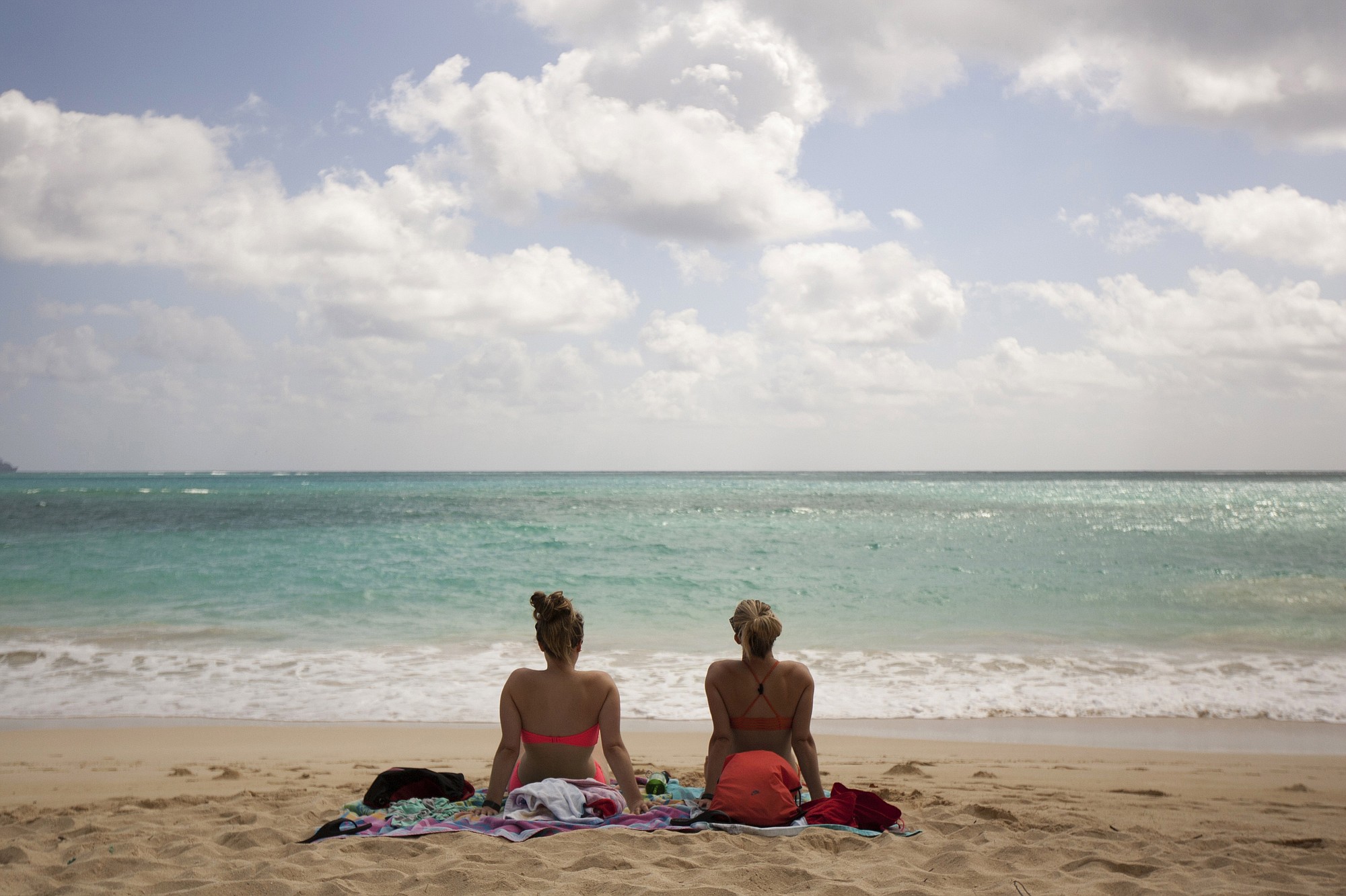 Ali Junell of Portland, left, and Kristen Carmichael of Los Angeles sit May 19 on the beach at Waimanalo Bay Beach Park in Waimanalo, Hawaii. The beach was listed as No.