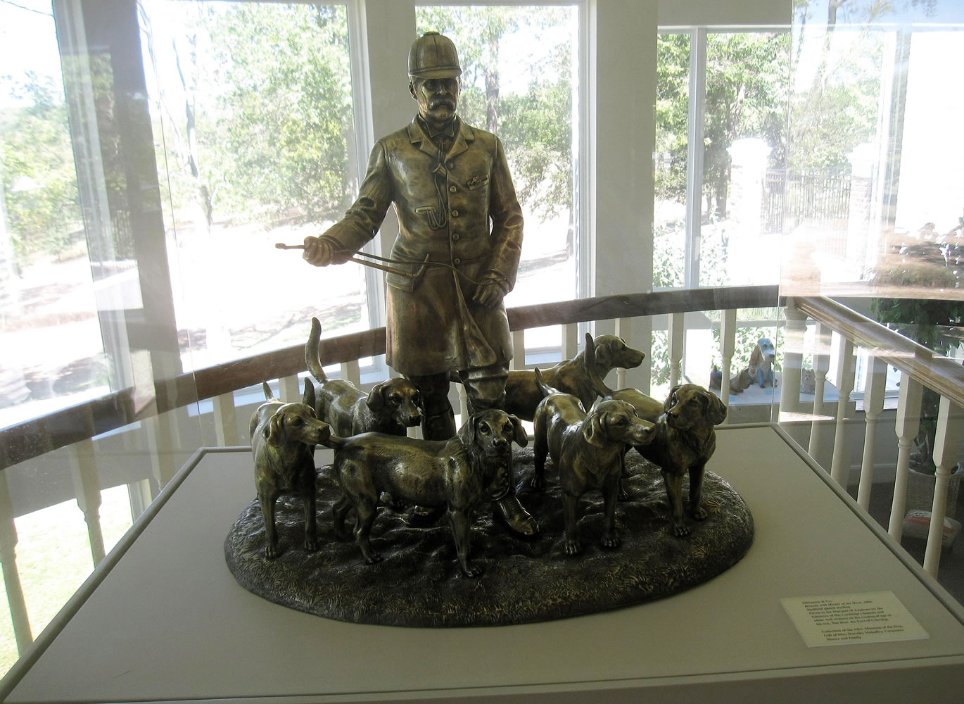 A sculpture of hounds with a hunt master is on display at the American Kennel Club Museum of the Dog.