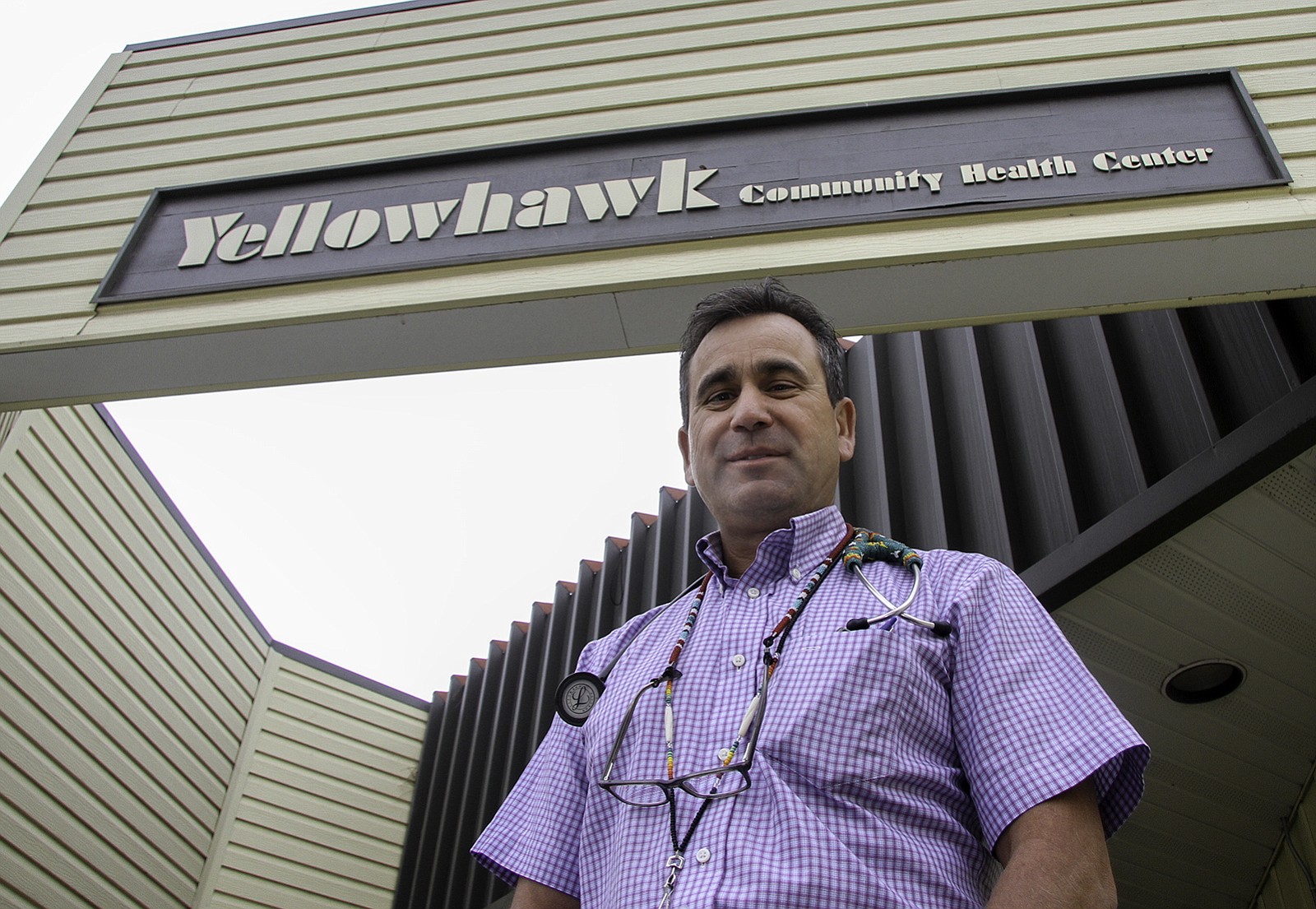 Dr. Rex &quot;Matt&quot; Quaempts, who grew up on Oregon's Umatilla Indian Reservation, poses last month in front of the Yellowhawk Community Health Center in Mission, Ore.