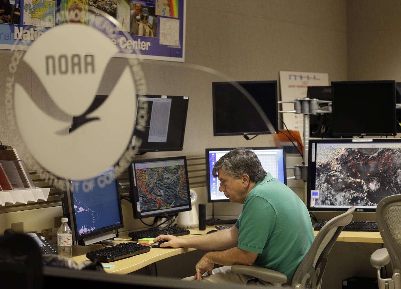Jack Beven, senior hurricane specialist, tracks the movement of Tropical Storm Erika as it moves westward towards islands in the eastern Caribbean, at the National Hurricane Center on Wednesday in Miami.