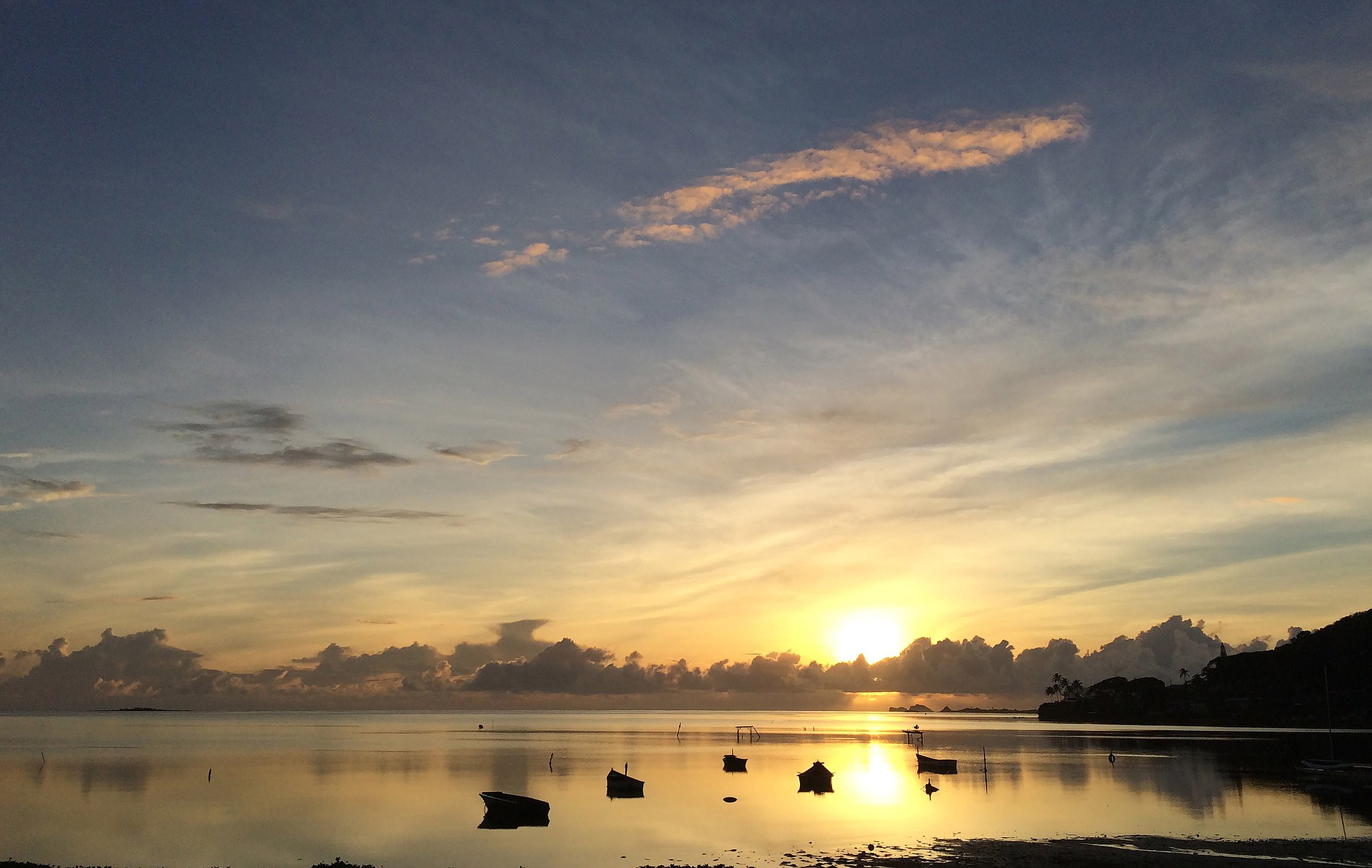 The sun rises Tuesday over Kaneohe Bay, which is closed to the public after heavy rains caused wastewater systems to overflow into the ocean in Kaneohe, Hawaii.
