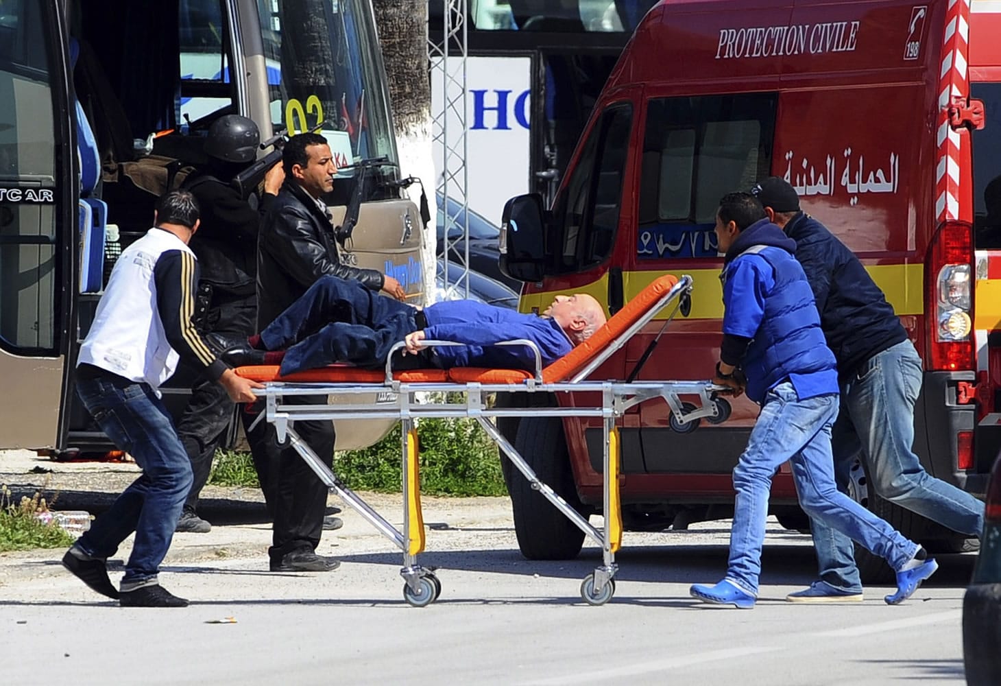 A man is evacuated outside the Bardo Museum after an attack on the museum by gunmen in Tunis on Wednesday.
