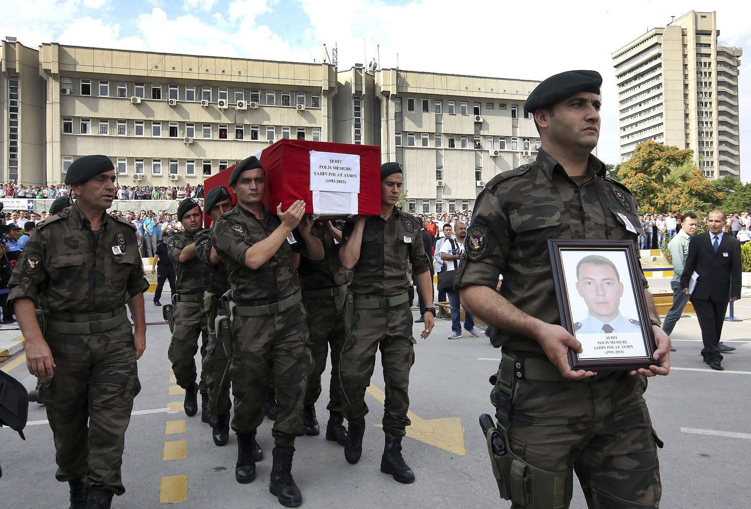 Turkish police officers carry the coffin of Turkish police special operations officer Sahin Polat Aydin, one of the four officers killed Monday in a landmine attack attributed to militants of  the Kurdistan Workers' Party, or PKK, in Silopi, southeastern Turkey, during a ceremony in Ankara, on Tuesday.