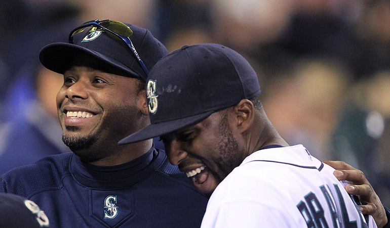 Seattle Mariners Ken Griffey, left, is retiring, according to his manager.
