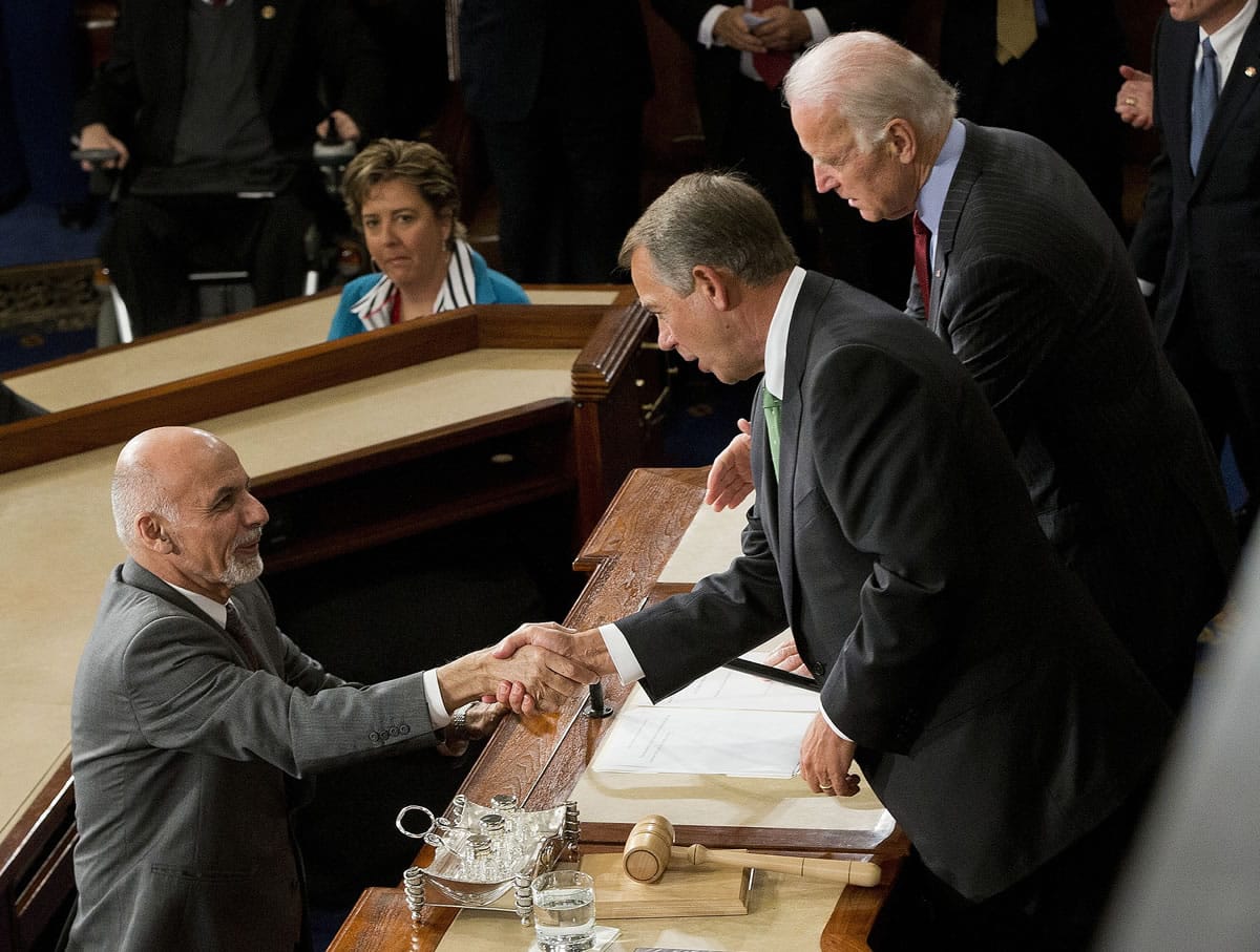 Afghanistan's President Ashraf Ghani shakes hands with House Speaker John Boehner of Ohio and Vice President Joe Biden after speaking before a joint meeting of Congress on Capitol Hill in Washington on Wednesday.