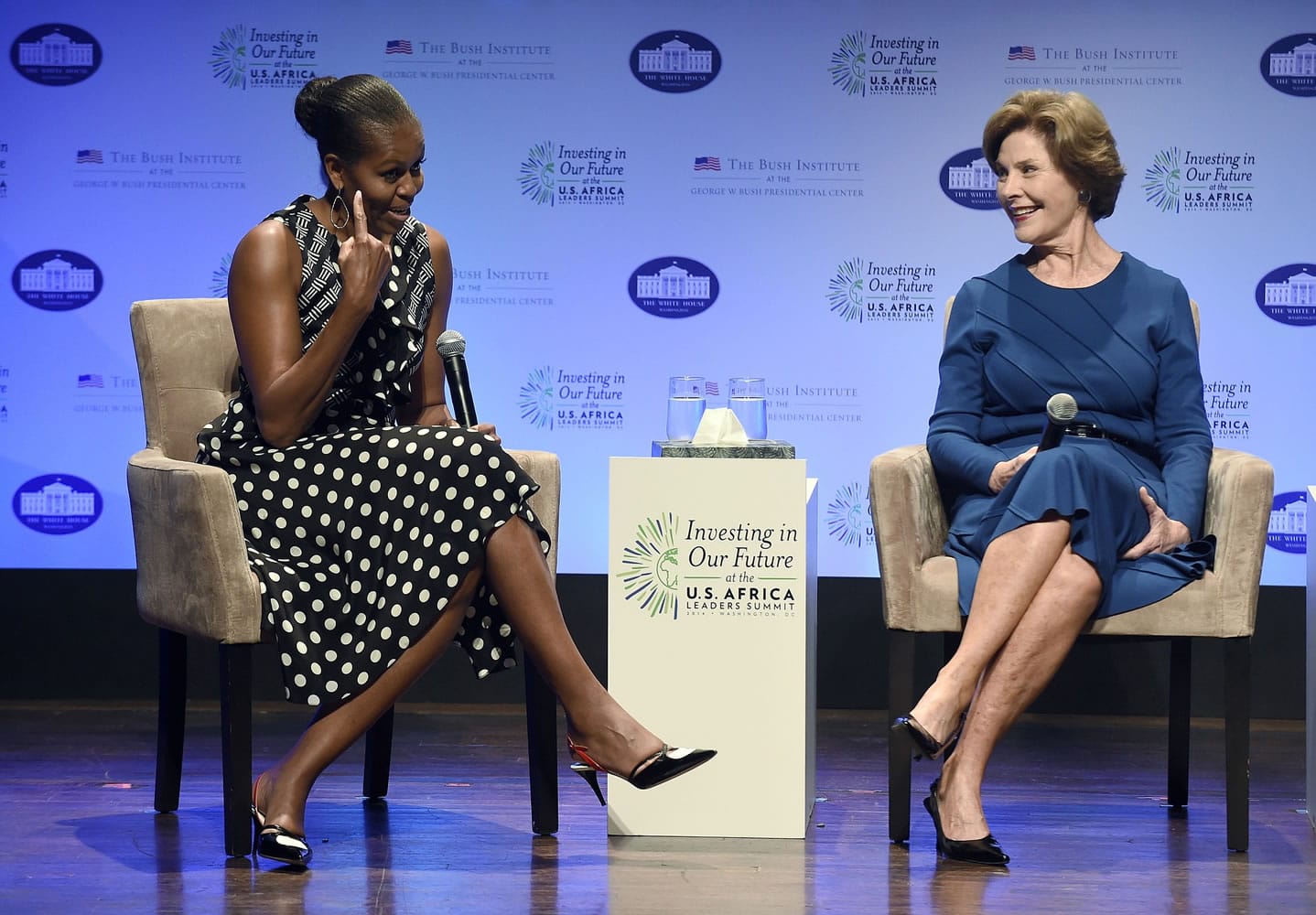 First lady Michelle Obama, left, sits with former first lady Laura Bush as they participate in &quot;Investing in Our Future,&quot; a discussion at the Kennedy Center in Washington on Wednesday.