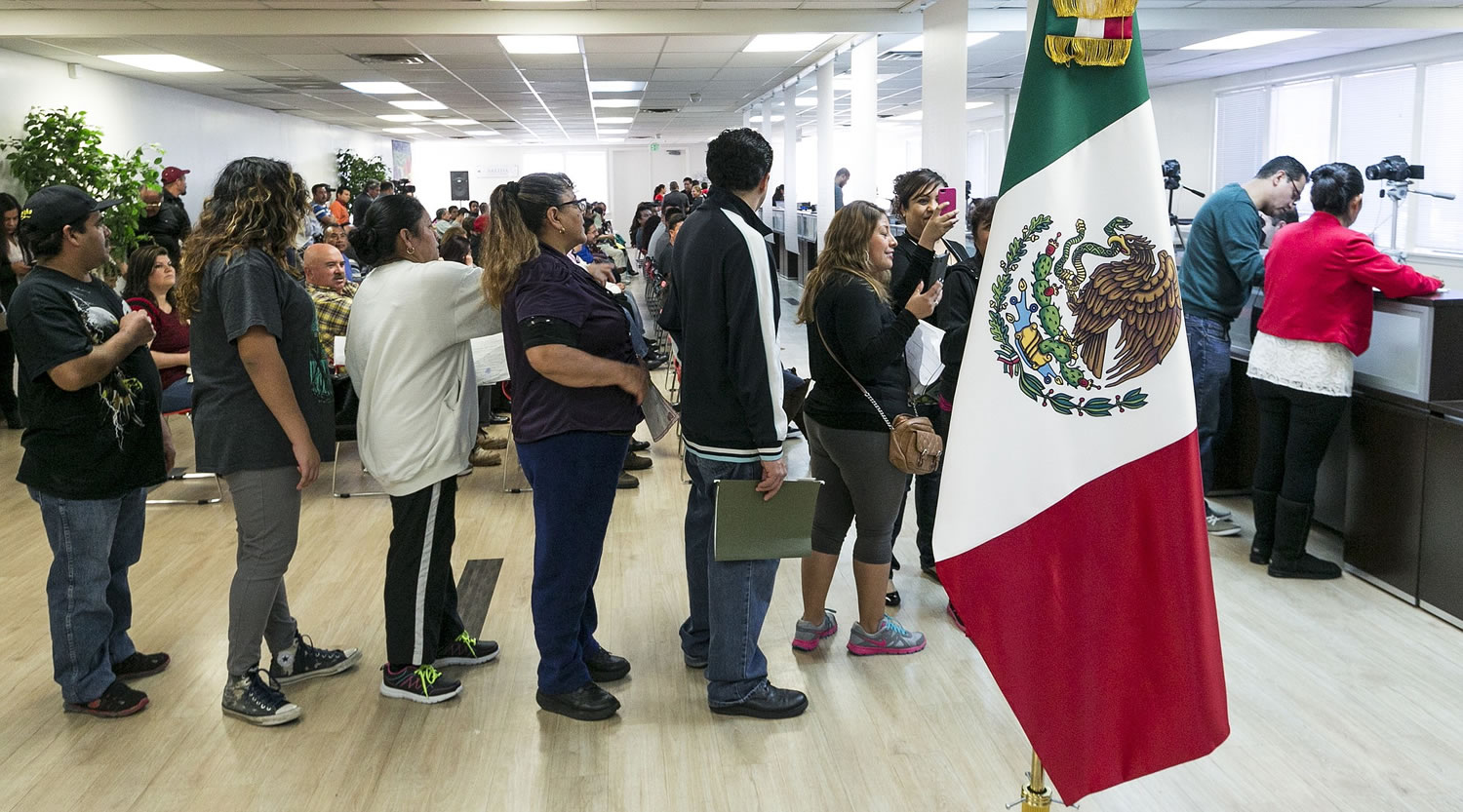 Mexicans citizens living in the U.S. wait in line to obtain their Mexican birth certificates at the Mexican consulate in Santa Ana, Calif., Thursday, Jan. 15, 2015. On Thursday, the Mexican government began issuing birth certificates to its citizens at its consulates in the United States. That will make it a little easier for Mexicans hoping to obtain U.S.