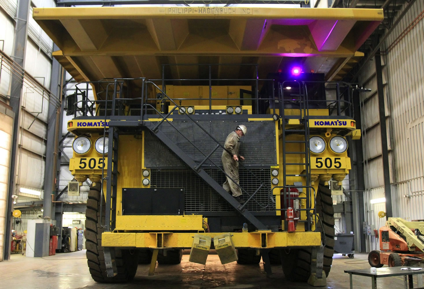 At more than 22-feet high, dump trucks at the Spring Creek Mine in Montana have a ramp that drivers can use to get in and out of the cab.
