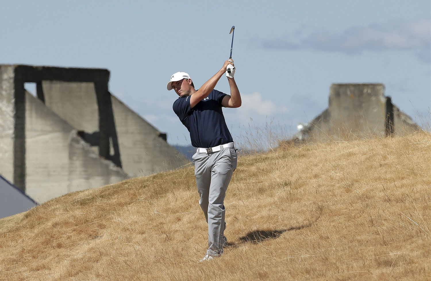 Jordan Spieth hits out of the tall fescue grass on the 18th hole during the second round of the U.S. Open golf tournament at Chambers Bay on Friday in University Place.