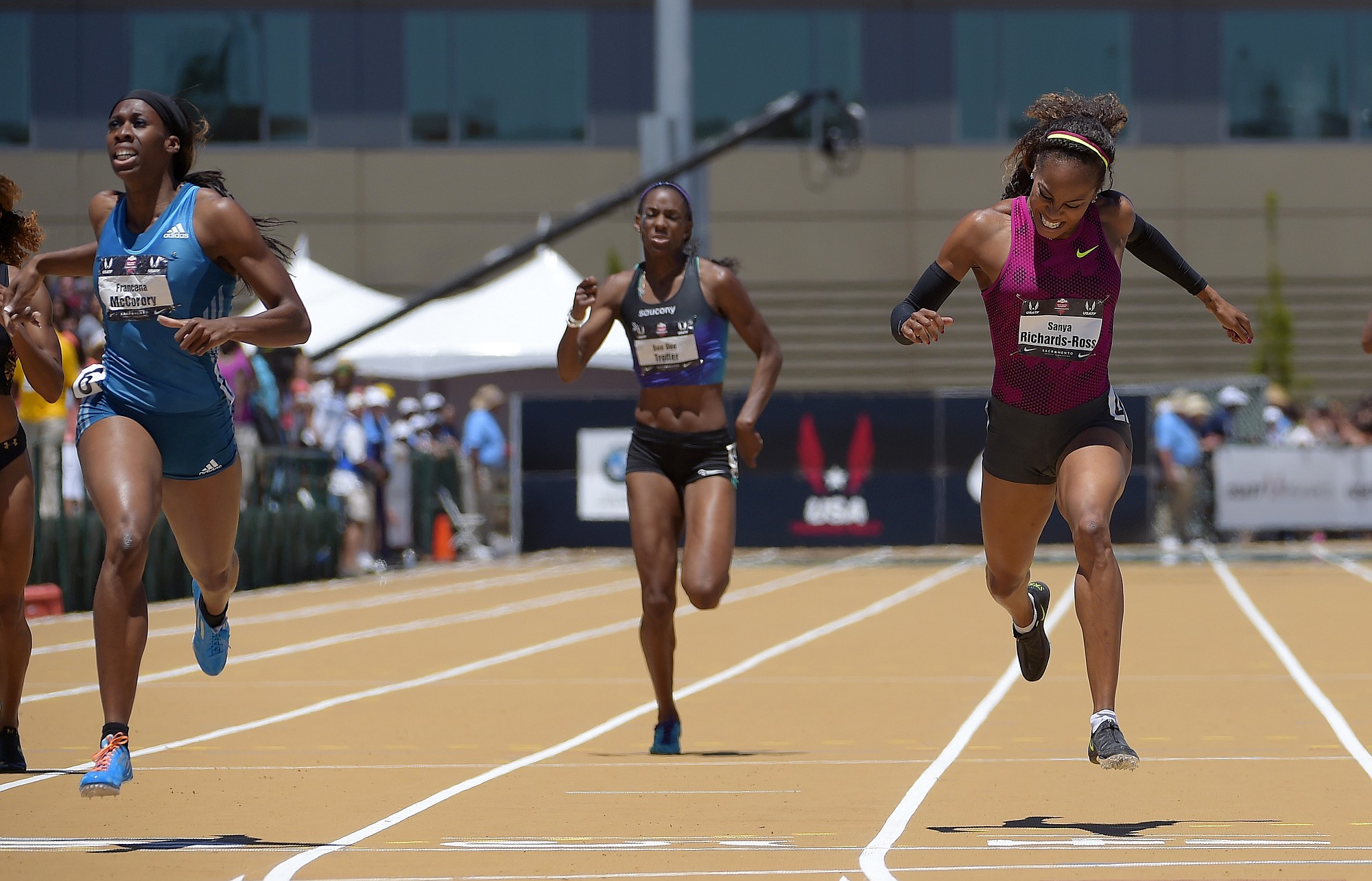 Francena McCorory, left, wins the women's 400 meters ahead of Sanya Richards-Ross, right, and Dee Dee Trotter at the U.S. outdoor track and field championships, Saturday, June 28, 2014, in Sacramento, Calif. Richards-Ross took second in the event. (AP Photo/Mark J.