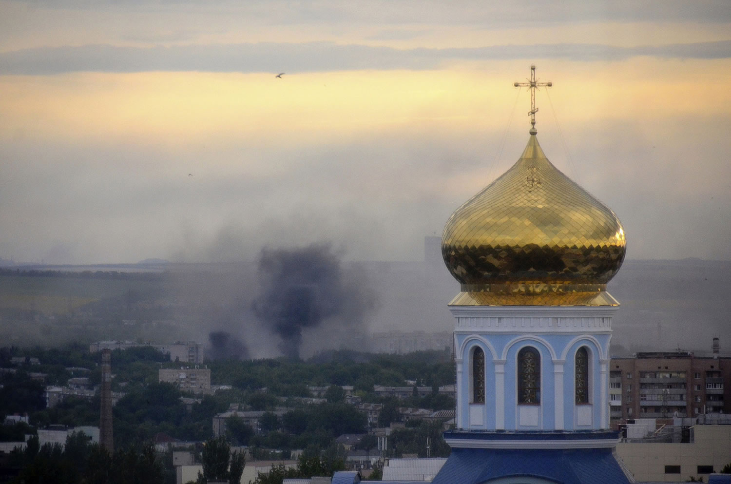Black smoke billows following a mortar attack July 14 during fighting between Ukrainian government troops and pro-Russian fighters in Luhansk, Ukraine.  The United States is considering imposing unilateral sanctions on Russia over its threatening moves in Ukraine, a shift in strategy that reflects the Obama administrationu2019s frustration with Europeu2019s reluctance to take tougher action against Moscow, according to U.S.
