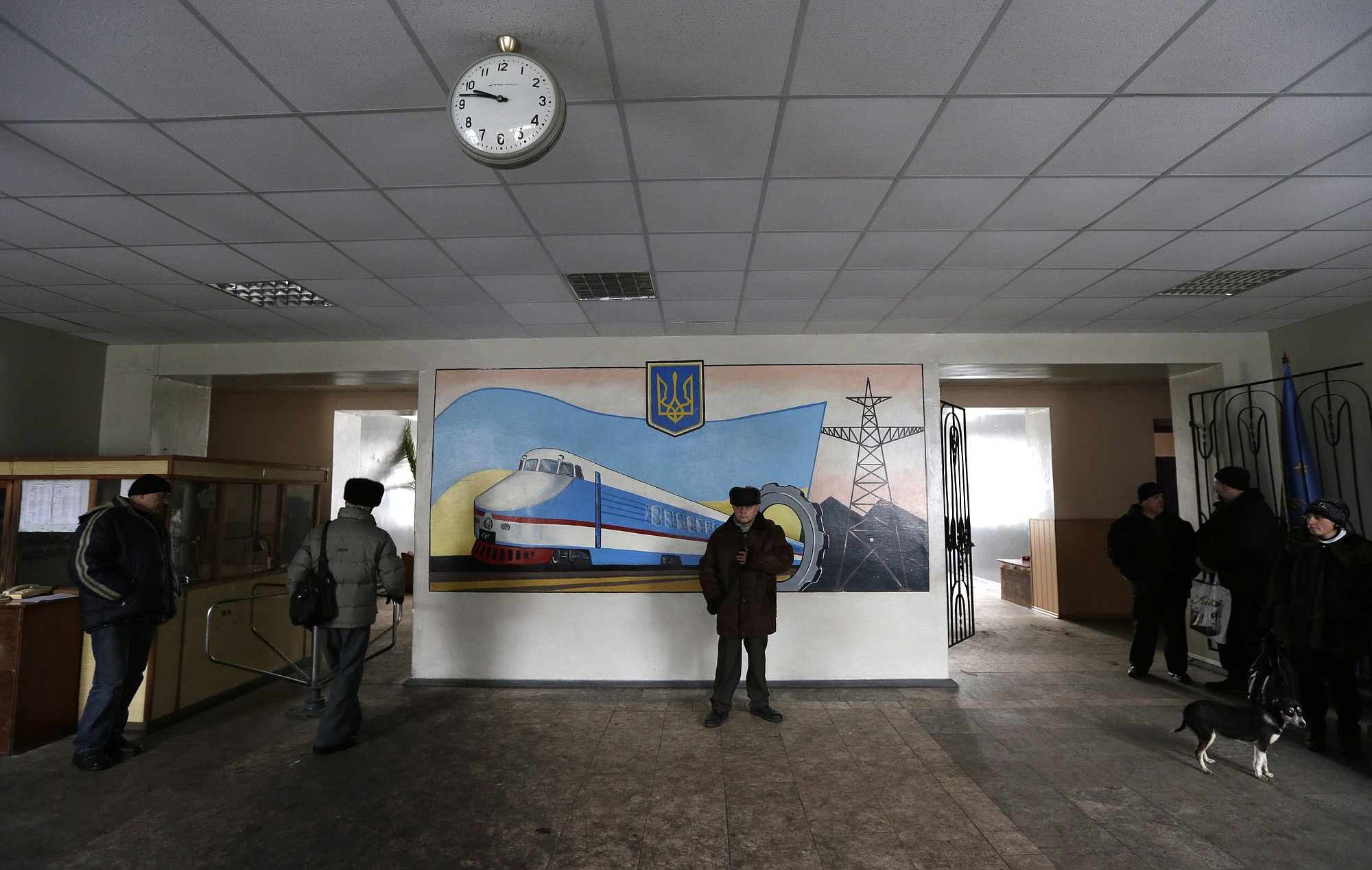 People wait in the hallway of city council Saturday building before leaving the town of Debaltseve, Ukraine.