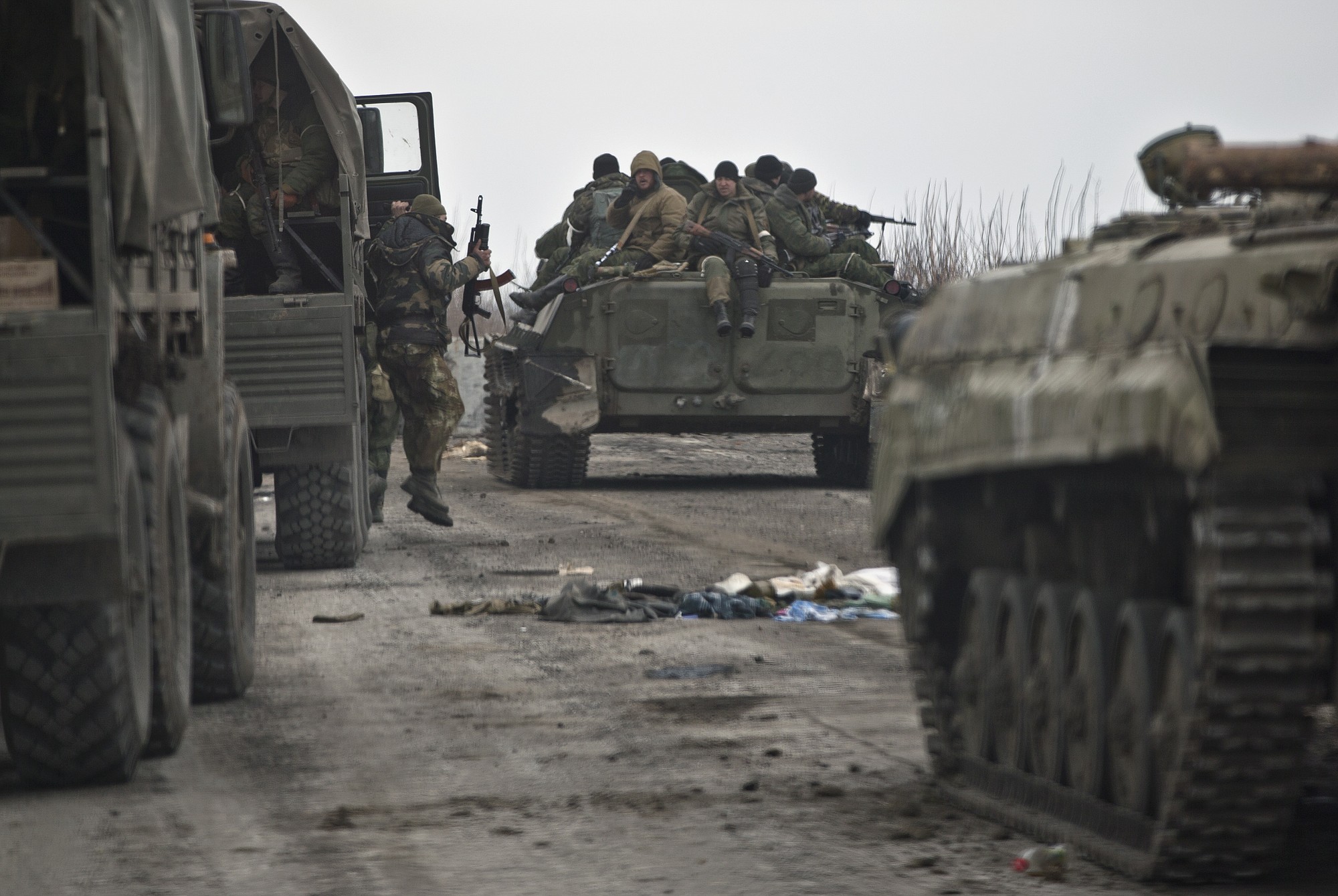 A Russia-backed rebel jumps out of a truck near Debaltseve, Ukraine, on Friday.