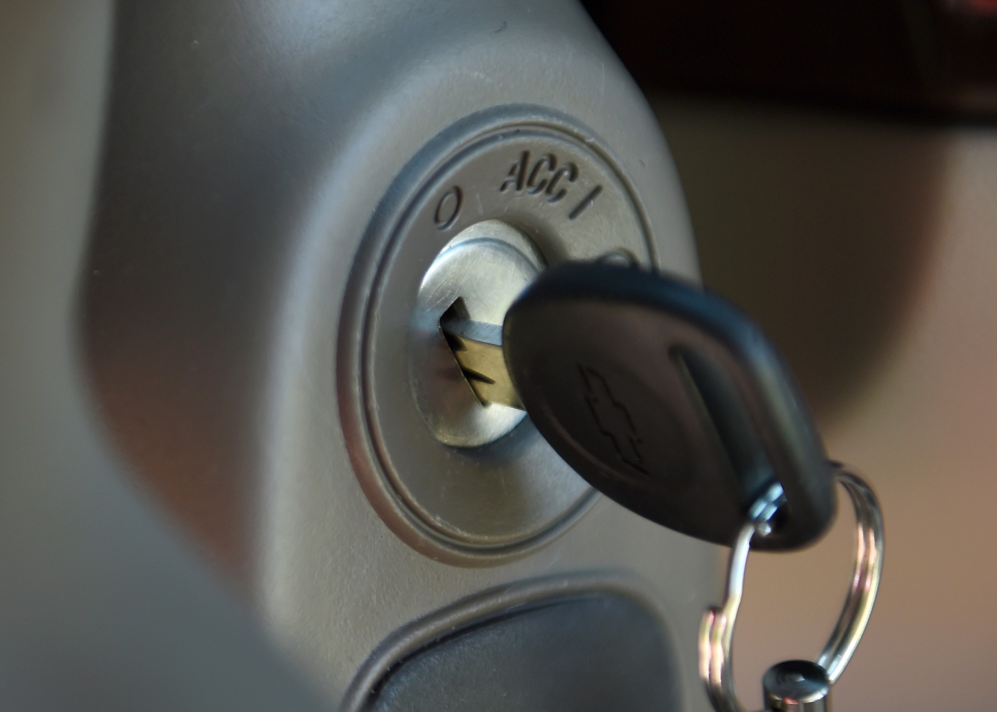 FILE - This Tuesday, April 1, 2014, file photo, shows a key in the ignition switch of a 2005 Chevrolet Cobalt in Alexandria, Va. Despite recall notices, thousands of news stories, highly publicized congressional hearings and two federal investigations, fewer than half of the roughly 2.36 million people still driving Chevy Cobalts, Saturn Ions and other small cars with defective and potentially deadly ignition switches have had them replaced.