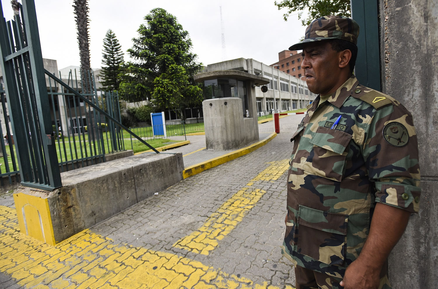A soldier stands guard at the entrance of the military hospital in Montevideo, Uruguay, on Monday.