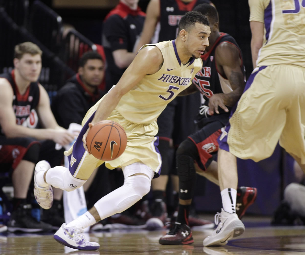 Washington's Nigel Williams-Goss drives against Utah in the first half on Saturday, March 7, 2015, in Seattle.