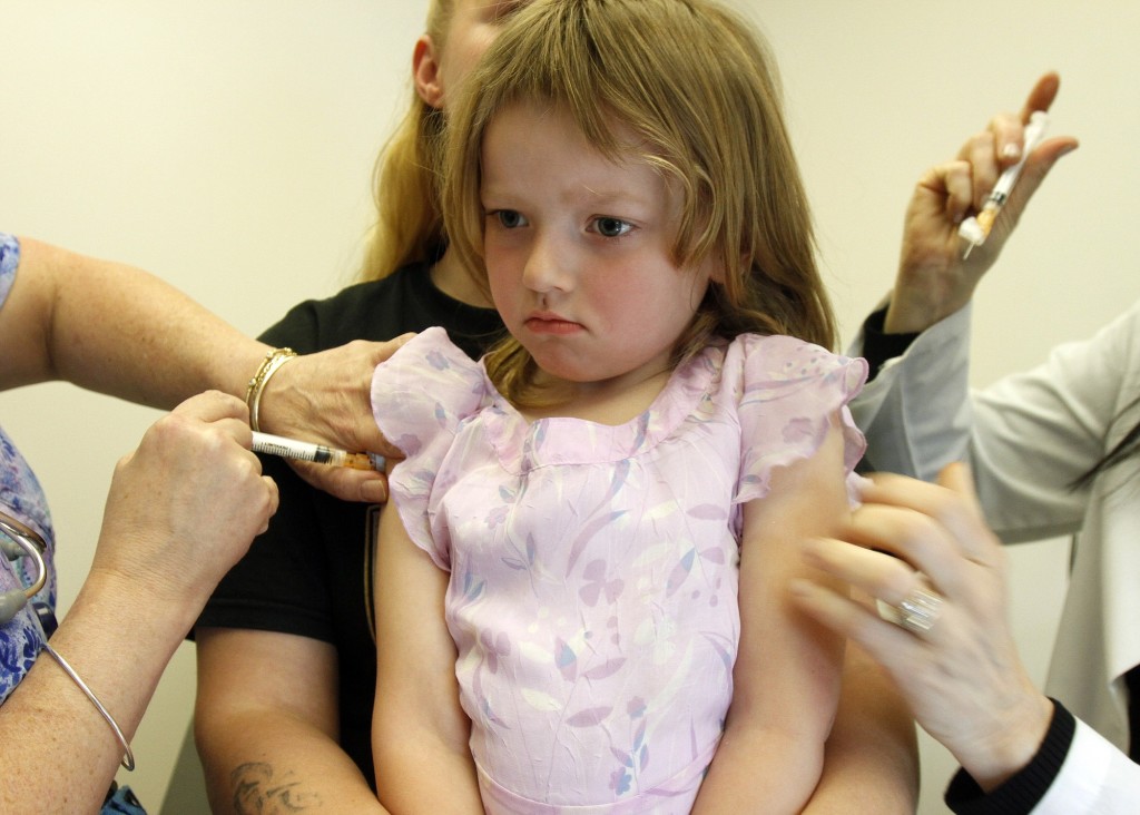 Holly Ann Haley, 4, gets two vaccinations at the doctor's office in Berlin, Vt.  The latest analysis of childhood vaccines released Tuesday confirms they're generally safe. The analysis mirrors and updates a 2011 report on vaccine safety by the U.S. Institute of Medicine.