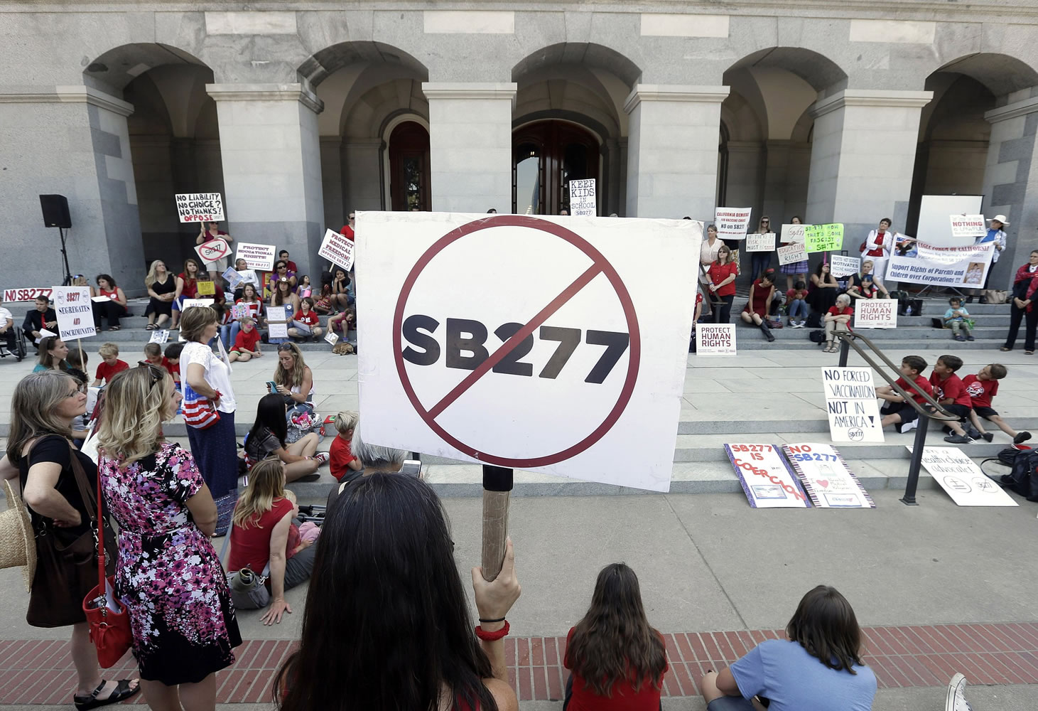 Opponents of a measure requiring nearly all California school children to be vaccinated gathered on the west steps of the Capitol after lawmakers approved the bill in Sacramento, Calif., on Thursday.
