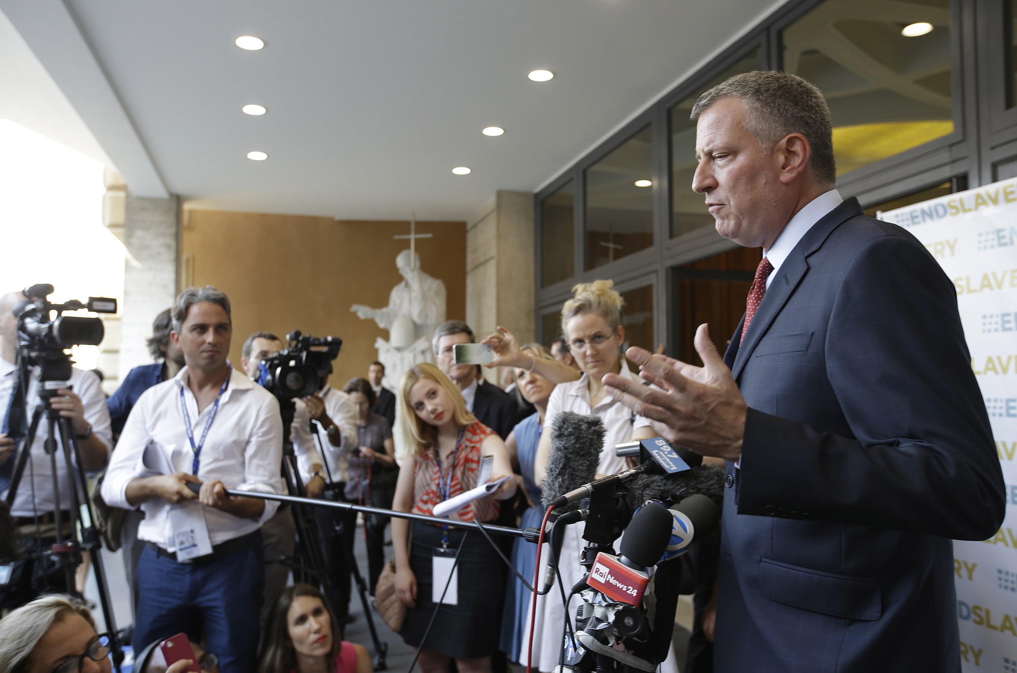New York Mayor Bill de Blasio holds a press conference outside the Synod Hall after participating in a conference on Modern Slavery and Climate Change at the Vatican on Tuesday.
