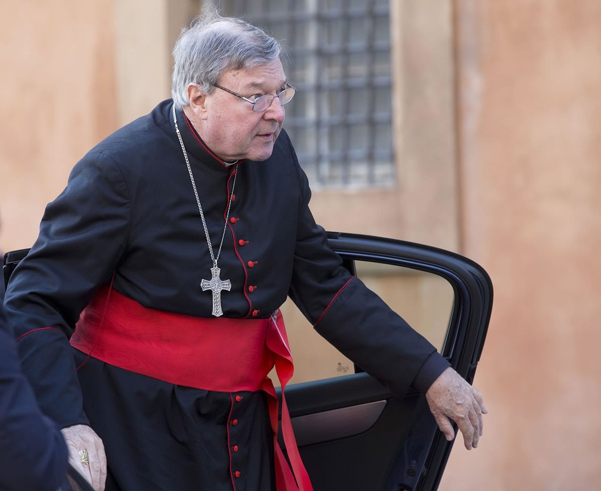 Cardinal George Pell arrives for a morning session of a synod on family issues, at the Vatican.