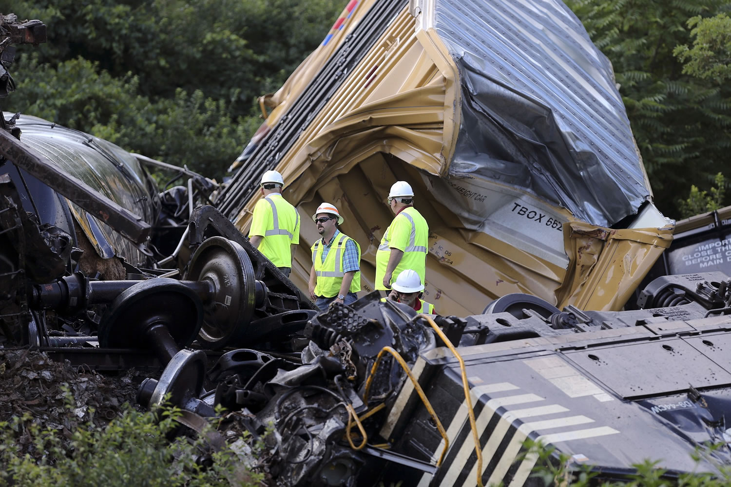 Investigators inspect the wreckage from a train derailment Tuesday near Dublin, Va.