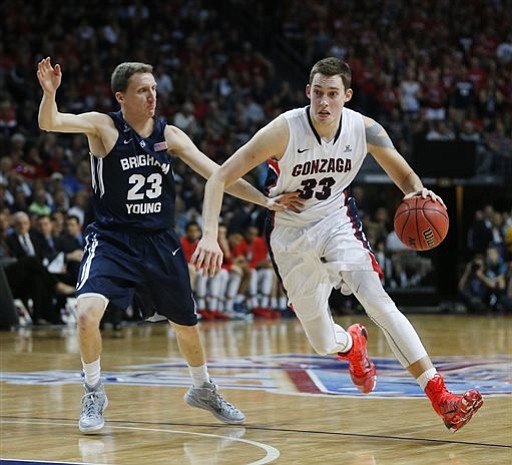 Gonzaga's Kyle Wiltjer, right, drives around BYU's Skyler Halford during the first half of the West Coast Conference tournament championship NCAA college basketball game Tuesday in Las Vegas.