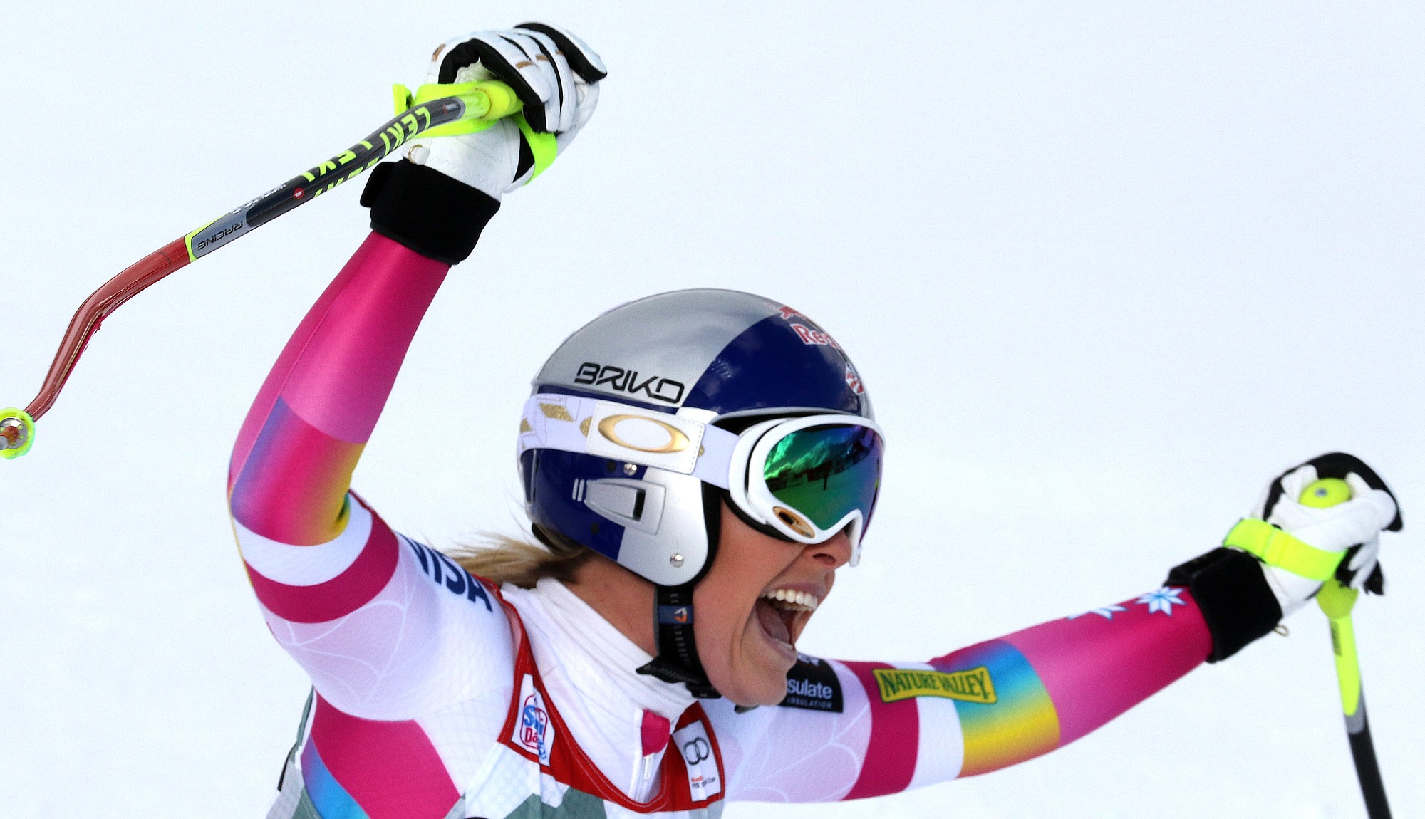 Lindsey Vonn celebrates in the finish area after winning the women's World Cup downhill in Cortina d'Ampezzo, Italy, Sunday, Jan. 18, 2015. Vonn's win matched Annemarie Moser-Proell's 35-year-old record of 62 World Cup wins, capping a comeback from two serious knee surgeries.