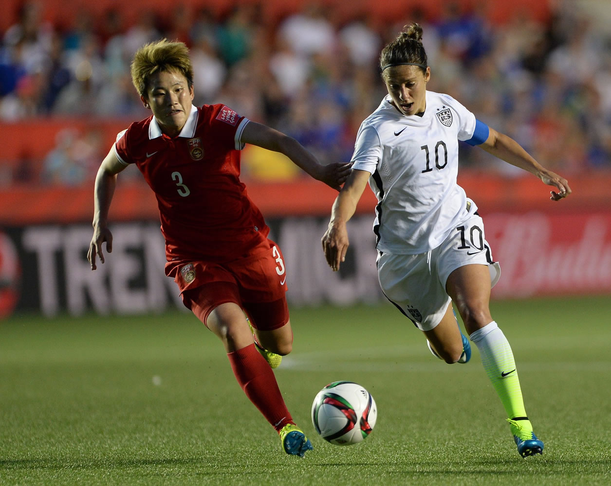 China's Pang Fengyue (3) chases United States' Carli Lloyd (10) during the second half of a quarterfinal match in the FIFA Women's World Cup soccer tournament, Friday, June 26, 2015, in Ottawa, Ontario, Canada.