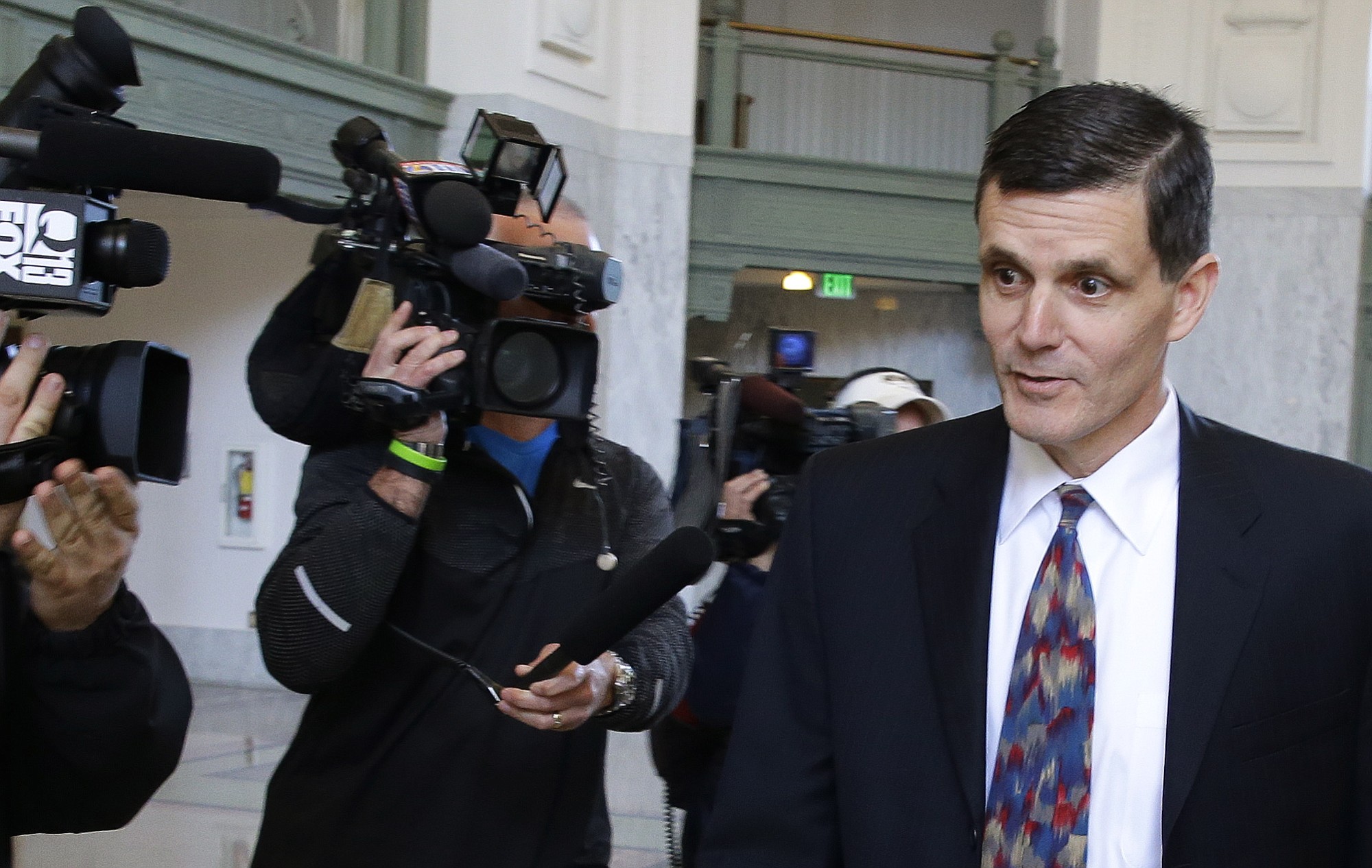 Washington state Auditor Troy Kelley leaves the Federal Courthouse in Tacoma on April 16, after pleading not guilty to a federal grand jury indictment on charges of filing false tax returns, obstruction, and possession of stolen property.